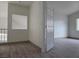 Hallway featuring modern railings, new flooring, and a view of the bedroom at 2606 Heartland Ave, Henderson, NV 89074