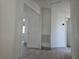 Hallway featuring modern railings, new flooring, and a view of the bedroom at 2606 Heartland Ave, Henderson, NV 89074