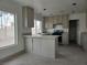 This kitchen features stone countertops, stainless steel appliances, and a window for natural lighting at 2606 Heartland Ave, Henderson, NV 89074