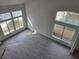 Bright, open living room with large windows, new floors, and plenty of natural light at 2606 Heartland Ave, Henderson, NV 89074