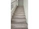 Staircase featuring modern railings, new flooring, and leading to the upper level at 2606 Heartland Ave, Henderson, NV 89074