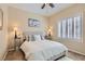 Comfortable bedroom with a queen bed and side tables. Windows include plantation shutters at 2743 Evergreen Oaks Dr, Henderson, NV 89052