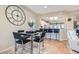 Open dining area with modern table and decor, next to the kitchen at 2743 Evergreen Oaks Dr, Henderson, NV 89052