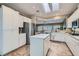 Bright kitchen features white cabinets, stainless steel appliances, and tile backsplash at 2743 Evergreen Oaks Dr, Henderson, NV 89052