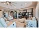 Spacious living room featuring neutral tones, an oversized fan, and comfortable furniture at 2743 Evergreen Oaks Dr, Henderson, NV 89052