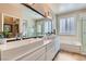 Beautiful main bathroom with double sinks, large mirror, soaking tub and shower at 2743 Evergreen Oaks Dr, Henderson, NV 89052