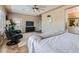 Large main bedroom featuring tile floors, lounging area and ensuite bathroom at 2743 Evergreen Oaks Dr, Henderson, NV 89052