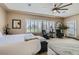 Bright main bedroom with shuttered windows and view to the lush landscaping at 2743 Evergreen Oaks Dr, Henderson, NV 89052