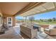 Relaxing covered patio with ample seating, firepit table and golf course views at 2743 Evergreen Oaks Dr, Henderson, NV 89052