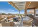 Inviting covered outdoor patio with comfortable seating and mountain views at 2743 Evergreen Oaks Dr, Henderson, NV 89052