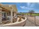 Secluded covered patio area with golf course views and desert landscaping at 2743 Evergreen Oaks Dr, Henderson, NV 89052
