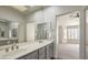 Bathroom features double vanity and access to the bedroom; a mirror enhances the space at 2824 Dry Plains Dr, Las Vegas, NV 89134