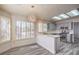 Eat-in kitchen features wood-look floors, white counters, gray cabinets, and stainless steel appliances at 2824 Dry Plains Dr, Las Vegas, NV 89134