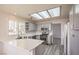 Bright kitchen with gray cabinets, white countertops, stainless steel appliances, and ample lighting at 2824 Dry Plains Dr, Las Vegas, NV 89134