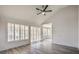 Spacious living area with vaulted ceilings, a ceiling fan, and shuttered windows overlooking the yard at 2824 Dry Plains Dr, Las Vegas, NV 89134