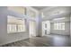 Open-concept living room with high ceilings and large windows, filled with natural light at 2824 Dry Plains Dr, Las Vegas, NV 89134
