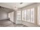 Bright, open living space with high ceilings, and wide windows dressed with shutter-style blinds at 2824 Dry Plains Dr, Las Vegas, NV 89134