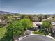 Aerial shot of a well-maintained home with mature trees in a suburban neighborhood at 3 Glendora Ct, Henderson, NV 89052