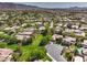 Overhead view of a residential area showcases green lawns and varied rooflines at 3 Glendora Ct, Henderson, NV 89052