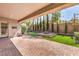Beautiful backyard featuring a patio, manicured lawn, landscaping, and a fire pit at 3 Glendora Ct, Henderson, NV 89052