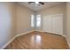 Comfortable bedroom with wood floors, closet, ceiling fan, and bright windows at 3 Glendora Ct, Henderson, NV 89052