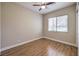 Inviting bedroom with hardwood flooring and large bright window at 3 Glendora Ct, Henderson, NV 89052