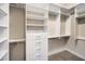 Spacious walk-in closet with custom shelving, drawers, and ample storage at 3 Glendora Ct, Henderson, NV 89052