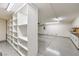 Spacious three-car garage with built in shelving and an epoxy floor at 3 Glendora Ct, Henderson, NV 89052