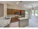 Modern kitchen with granite countertops, island, and stainless steel appliances offers style and functionality at 3 Glendora Ct, Henderson, NV 89052