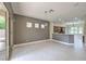 Bright, open living area flowing into kitchen, enhanced by tile flooring and ample natural light at 3 Glendora Ct, Henderson, NV 89052