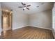 This primary bedroom is spacious with lovely hardwood floors, a ceiling fan, and lots of light at 3 Glendora Ct, Henderson, NV 89052