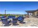 Comfortable outdoor seating area with plush blue cushions, perfect for relaxing and enjoying the views at 3 Glendora Ct, Henderson, NV 89052