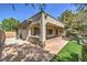 Outdoor patio with a built-in grill, artificial turf, and landscaped yard for serene outdoor living at 3 Glendora Ct, Henderson, NV 89052