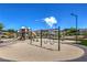 Vibrant community playground with swings, slides, and climbing structures on a sunny day at 3 Glendora Ct, Henderson, NV 89052