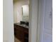 Bathroom featuring dark wood vanity and mirror at 30 Strada Di Villaggio # 631, Henderson, NV 89011