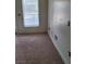 Neutral bedroom with carpet, a window for natural light, and baseboard trim at 30 Strada Di Villaggio # 631, Henderson, NV 89011