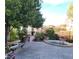 Community courtyard featuring a bench, fountain, and lush landscaping at 30 Strada Di Villaggio # 631, Henderson, NV 89011