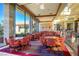 Inviting activity room with comfortable seating, tables for games, and large windows providing abundant natural light at 3051 Scotts Valley Dr, Henderson, NV 89052