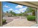 Beautiful backyard featuring desert landscaping, mature palm trees, stone walkways, and mountain views for outdoor enjoyment at 3051 Scotts Valley Dr, Henderson, NV 89052