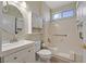 Bathroom with a bathtub, shower combo, vanity, and neutral decor at 3051 Scotts Valley Dr, Henderson, NV 89052