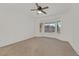 Bright bedroom featuring a ceiling fan and a bay window offering plenty of natural light at 3051 Scotts Valley Dr, Henderson, NV 89052