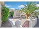 Inviting home exterior with manicured hedges, attractive gated entrance, and desert landscaping at 3051 Scotts Valley Dr, Henderson, NV 89052