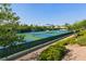 Beautifully maintained tennis courts surrounded by lush greenery, providing an excellent recreational space at 3051 Scotts Valley Dr, Henderson, NV 89052