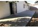 A plain concrete back patio with access to the main house and a walled-in block fence at 3258 Glenhurst Dr, Las Vegas, NV 89121