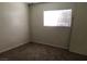 Bedroom featuring carpet, window, and basic electrical fixtures at 3258 Glenhurst Dr, Las Vegas, NV 89121