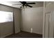 Carpeted bedroom with a ceiling fan, window with blinds, and electrical outlets at 3258 Glenhurst Dr, Las Vegas, NV 89121
