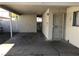 Covered carport area providing sheltered parking and access to the house with a security door at 3258 Glenhurst Dr, Las Vegas, NV 89121