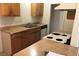 Functional kitchen featuring laminate countertops, basic appliances, and wood cabinetry at 3258 Glenhurst Dr, Las Vegas, NV 89121
