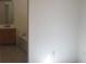 Bathroom features vanity sink, tile flooring, and a soaking tub at 33 Newburg Ave, North Las Vegas, NV 89032