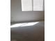 Bedroom featuring blinds, natural lighting, and a neutral toned carpet at 33 Newburg Ave, North Las Vegas, NV 89032